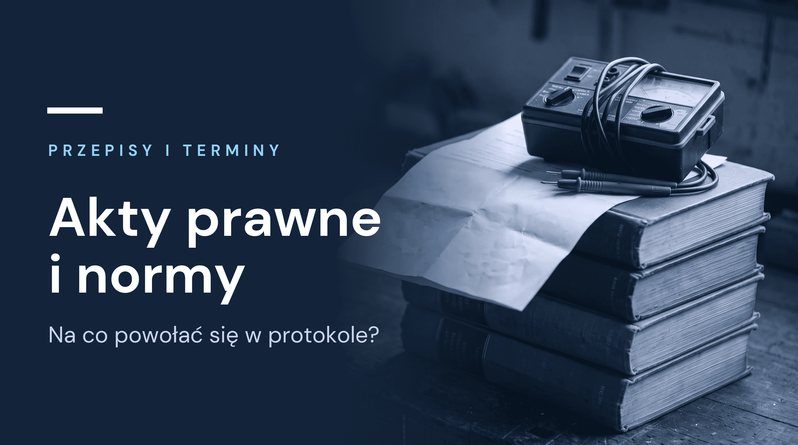 Stos tomów z przepisami, na nich wydruk protokołu i miernik z przewodami pomiarowymi